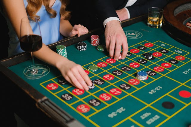 Woman placing chips on a roulette game